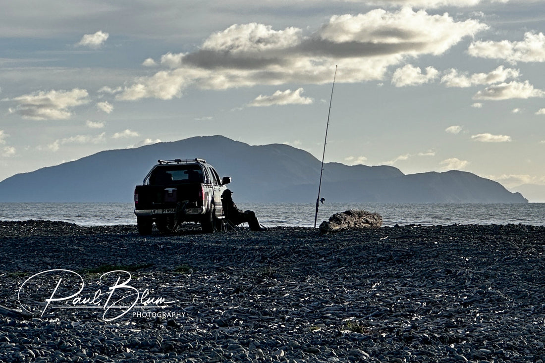 Solitude by the Sea: Fishing at Dusk